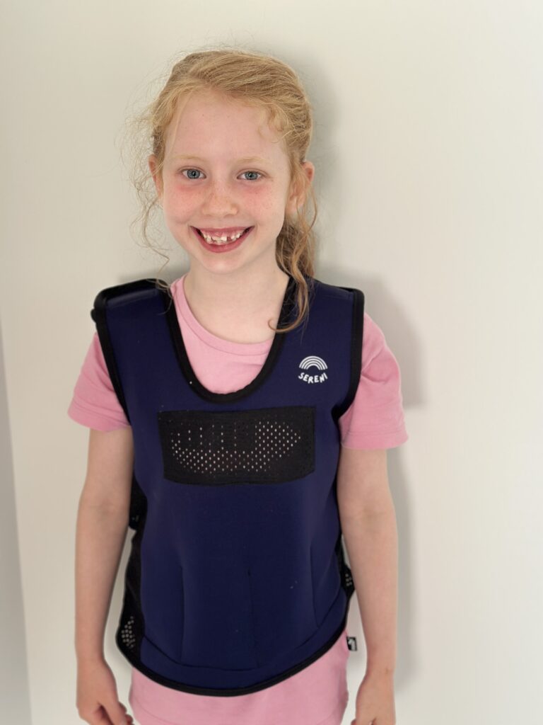 Living with ADHD: The Tools That Help Us Thrive | How to be a Mother y no Morir en el Intento Lucia wearing the calm vest