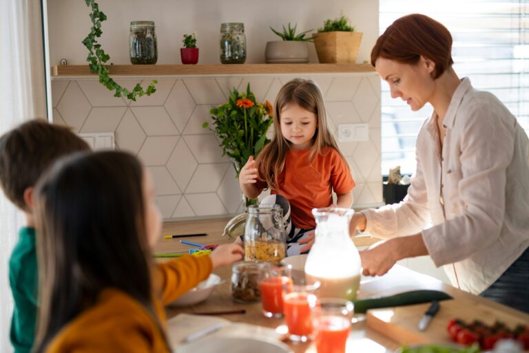 Mum with kids in the kitchen having breakfast before school - ADHD morning routine UK, ADHD survival pack