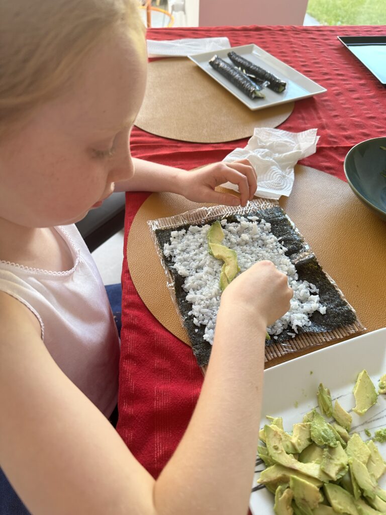 Half-Term Activities for Kids: 5 Brilliant Ideas to Keep Kids Happy (and Mums Sane!) | How to be a Mother y no Morir en el Intento Lucia making sushi, half-term activities for kids