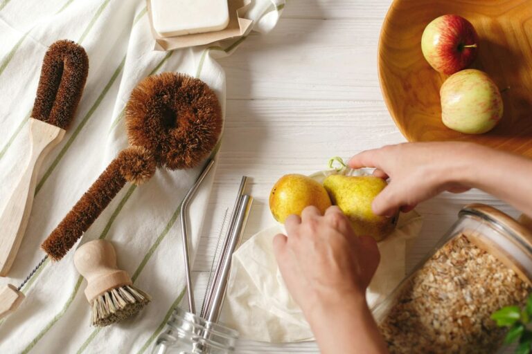 Sustainable kitchen swaps for a greener home using reusable brushes, jars and fresh food